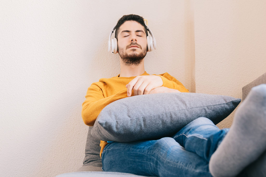 adult man listening to music